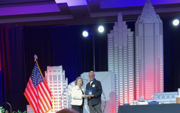 Debbie Donaldson receiving the Georgia REALTORS® Good Neighbor Award in Henry County